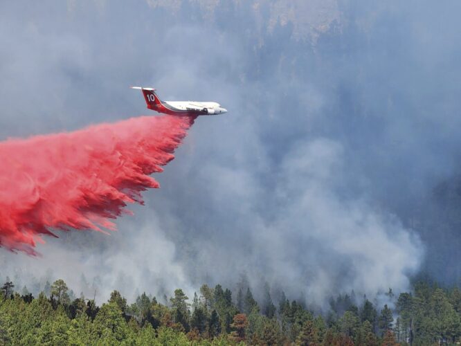 California wildfire grows as heat wave creates worry; South Dakota conditions improve